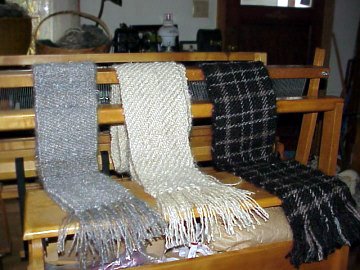 several mohair scarves on display